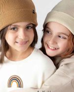 happy girls wearing beanie